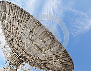 Large satellite antenna soaring into sky