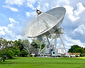 Large satellite dish and station with cloudy sky in Thailand