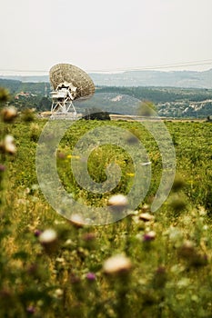 Large satellite dishes in countryside