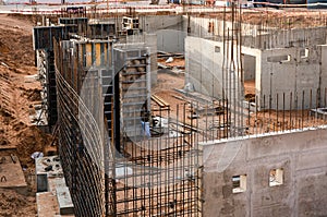 Large scale construction site featuring the foundation of what will be a large skyscraper