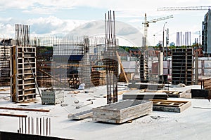 Large scale construction site featuring the foundation of what will be a large skyscraper