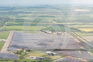 Large scale solar farm in rural landscape showing panels situated on farmland