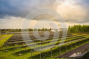 Large scale solar farm with the satellite dishes under dramatic