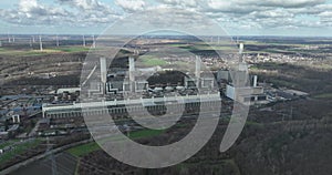 Large sclae industrial power plant. Fossil fuels turn into energy and electricty. Aerial drone view.