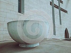 Large sculpture in the form of a bowl or cup on the façade of the cathedral in Abidjan