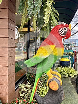 Large sculpture of a parrot on the street