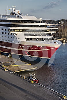 Large sea ferry and a small fire boat