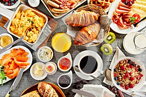 Large selection of breakfast food on a table photo