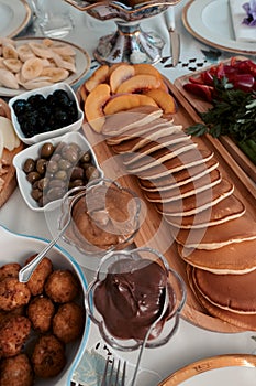 Breakfast table with food served