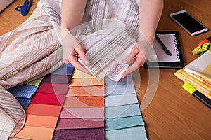 Large selection of fabric samples for interior decoration on table