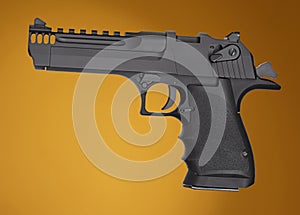 Large semi automatic pistol on orange