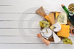 A large set of cheeses. Mozzarella, blue cheese, brie cheese, maasdam.