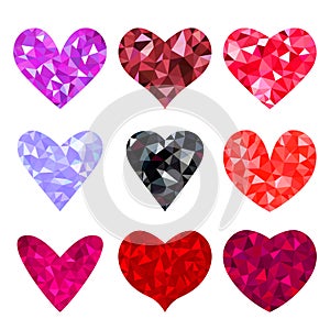 A large set of red raspberry and black hearts in a polygonal triangulation style.