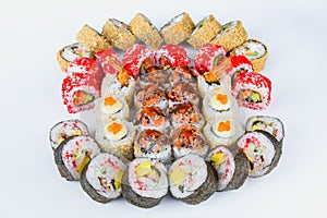Large Set of sushi roll pieces with seafood and raw fish. Futomaki and tempura sushi rolls.