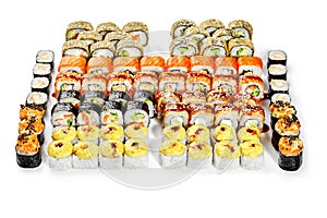 Large set of various Japanese sushi rolls on white background