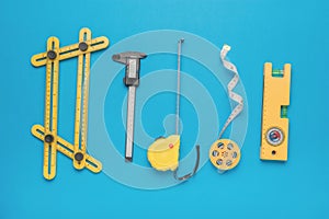 A large set of various measuring instruments on a blue background