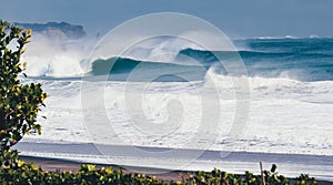 Large set waves rolling into Hebara Beach photo