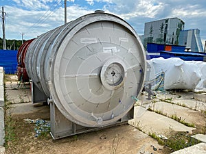 Large shiny stainless steel shell and tube heat exchanger for heating liquids and gases, ready to be installed for oil refinery