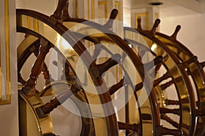 Large ships wheel at the helm of a sailing ship.