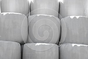 Large Silage Bales Wrapped in White Plastic Background