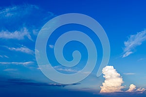 Large single cloud in a blue sky.