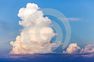 Large single cloud in a blue sky.