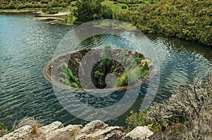 Large sinkhole in a dam lake on the highlands photo