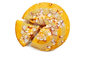 A large-sized ripe palmyra palm fruit cake sprinkled with coconut pieces.