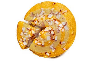 A large-sized ripe palmyra palm fruit cake sprinkled with coconut pieces.