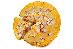 A large-sized ripe palmyra palm fruit cake sprinkled with coconut pieces.