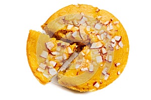 A large-sized ripe palmyra palm fruit cake sprinkled with coconut pieces.