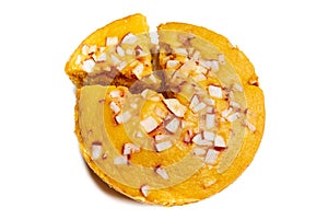 A large-sized ripe palmyra palm fruit cake sprinkled with coconut pieces.