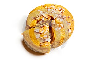 A large-sized ripe palmyra palm fruit cake sprinkled with coconut pieces.