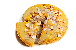 A large-sized ripe palmyra palm fruit cake sprinkled with coconut pieces.