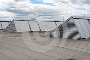 Large skylights and hydro insulation membranes on modern industrial hall