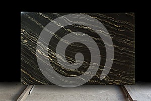 A large slab of natural stone in black marble with yellow stripes is called Quarzite Portoro Gold