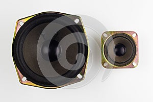 Large and small loudspeakers on a white background