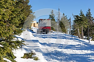 Large snowmobile in the winter forest