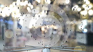 Large spinning fan and swirling dust on a blurred background.