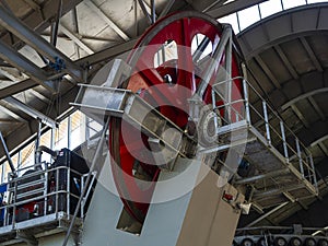 large spinning wheel at the main station of the cable car