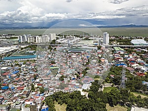 A large squatter colony sandwiched between industrial areas, an affluent subdivision and the Metro Manila skyway. Laguna de Bay in