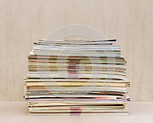 A large stack of magazines close-up