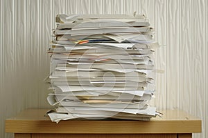Large stack of messy documents and papers