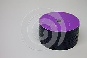 Large stack of purple cd disks