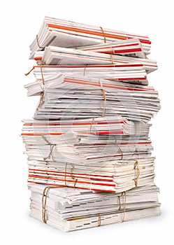 A large stack of white magazines