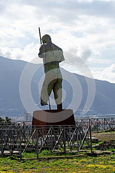 large statue in the house of Romolo and Remo in the archaeological park of Pompeii, Italy.