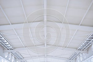 Large steel structure truss, roof frame and metal sheet in the building construction site