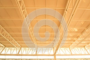 Large steel structure truss, roof frame and metal sheet in the building construction site