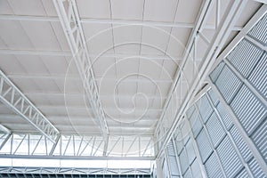 Large steel structure truss, roof frame and metal sheet in the building construction site