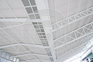 Large steel structure truss, roof frame and metal sheet in the building construction site